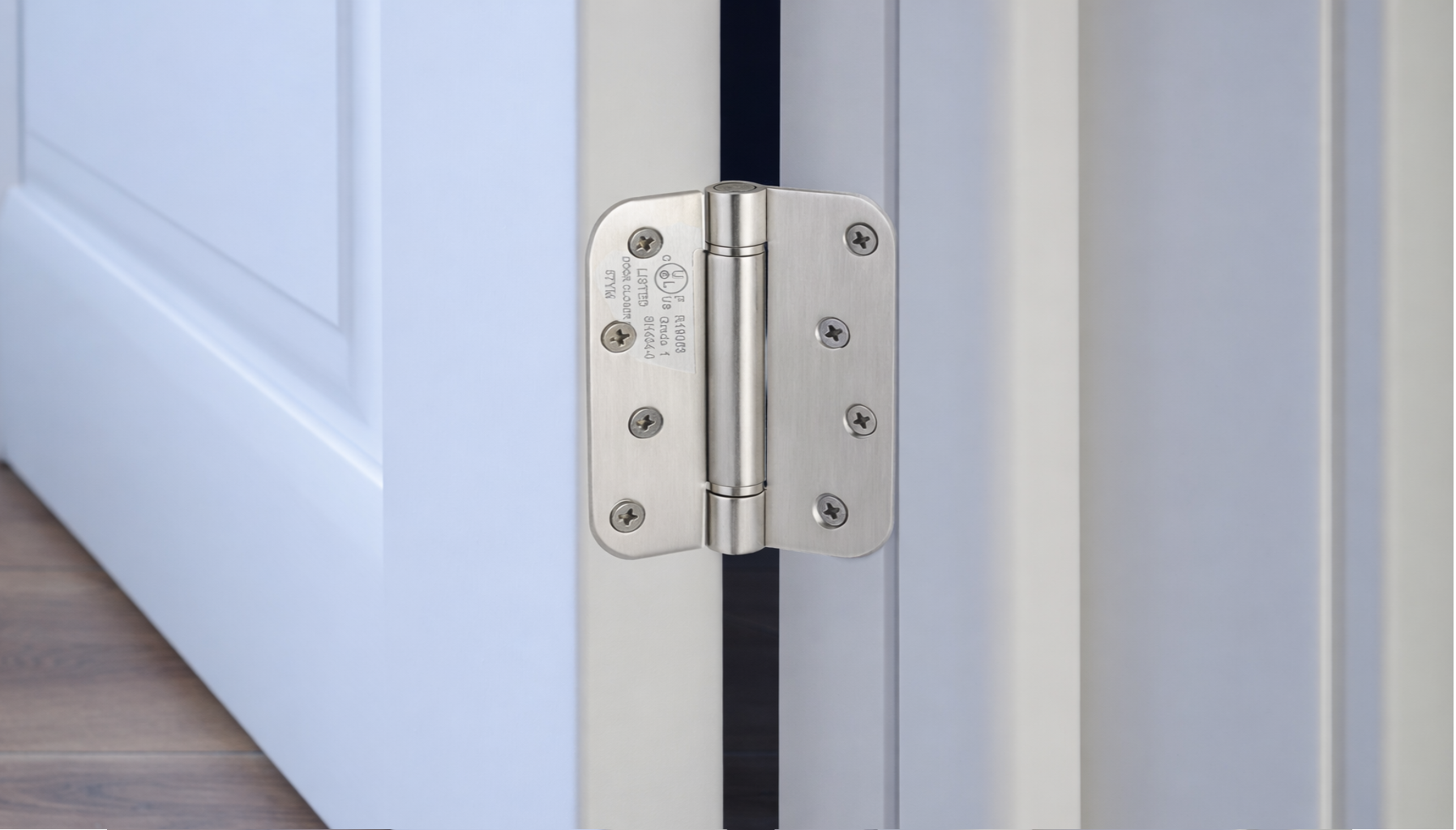 MAZENHARD black steel door hinges displayed on wood